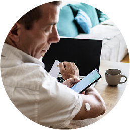 Man with phone and computer